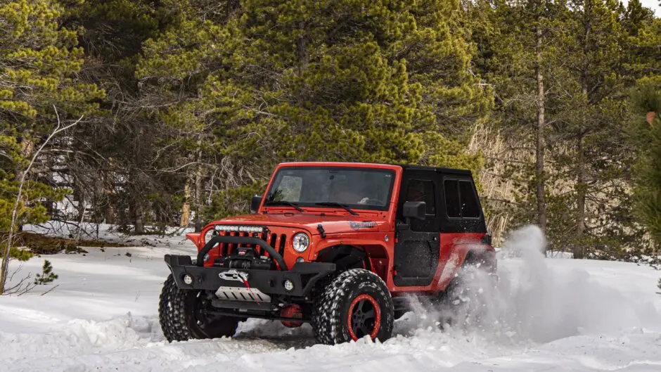 Bestop-equipped Jeep Wrangler driving through the snow